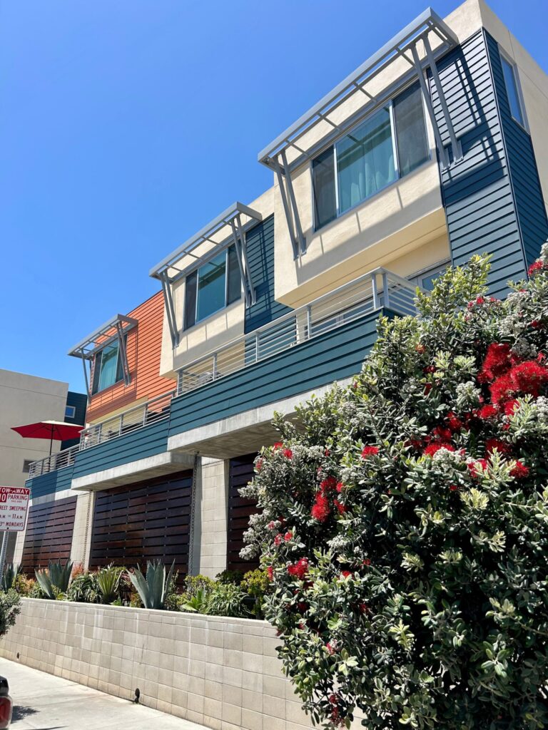 Outside of an apartment complex repainted with fresh, lively colors in Imperial Beach, California